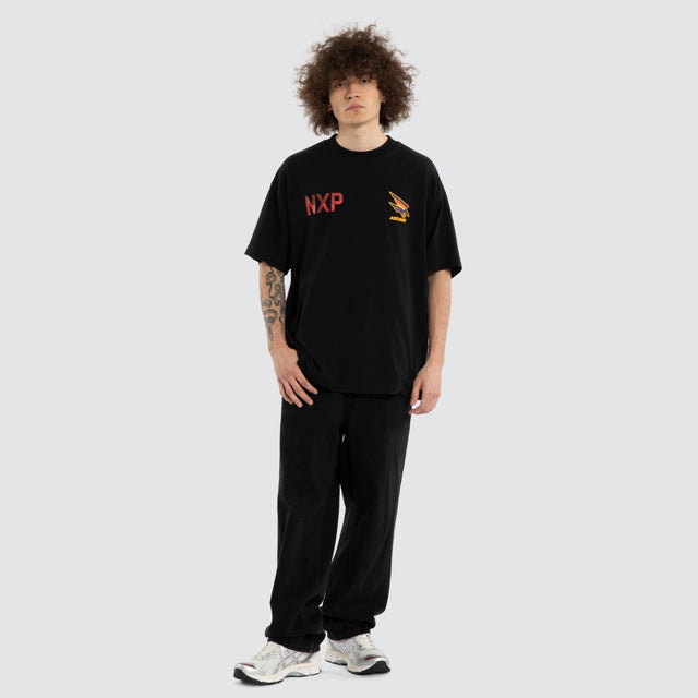 Model wears Ben Davis Adelaide Crows AFL Raptor Tee Jet Black T-Shirts in Black - Image 7