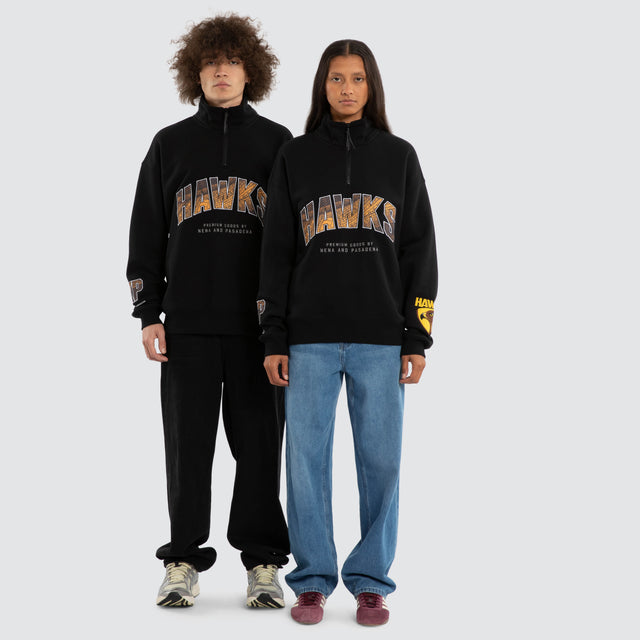 Model wears Ben Davis Hawthorn Hawks AFL 1/4 Zip Thru Jet Black Pullover in Black - Image 4