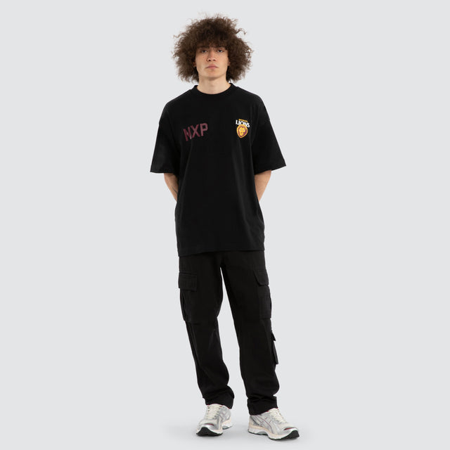 Model wears Ben Davis Brisbane Lions AFL Raptor Tee Jet Black T-Shirts in Black - Image 7