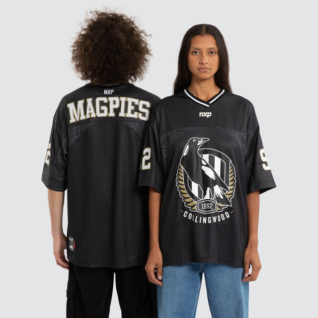 Model wears Ben Davis Collingwood Magpies AFL Mesh Jersey Magpies Black Jerseys in Black - Image 1