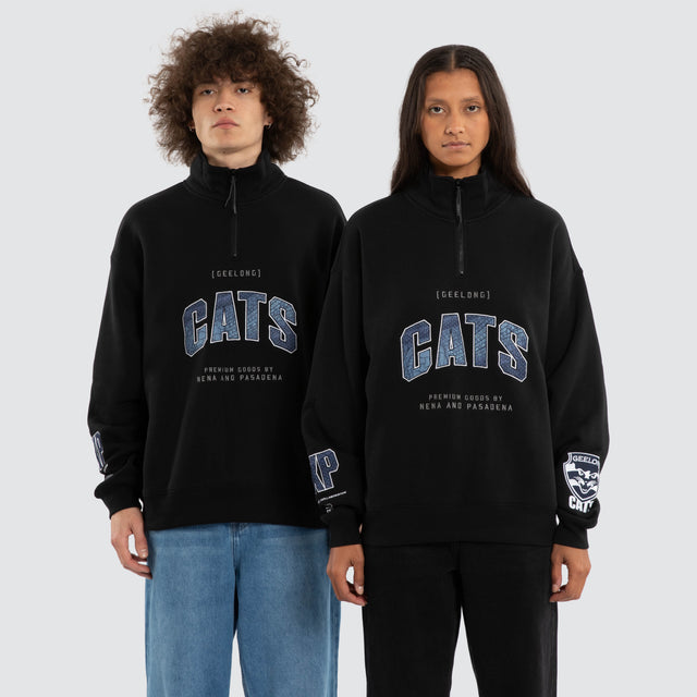 Model wears Ben Davis Geelong Cats AFL 1/4 Zip Thru Jet Black Pullover in Black - Image 1