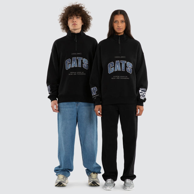 Model wears Ben Davis Geelong Cats AFL 1/4 Zip Thru Jet Black Pullover in Black - Image 4