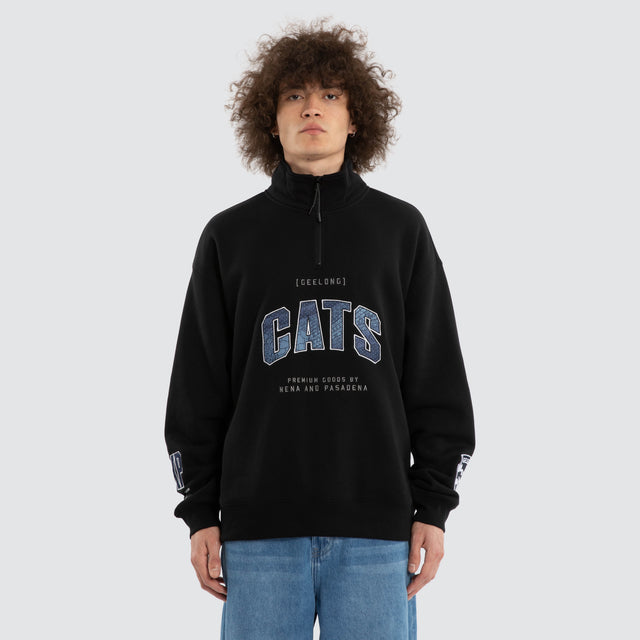 Model wears Ben Davis Geelong Cats AFL 1/4 Zip Thru Jet Black Pullover in Black - Image 2