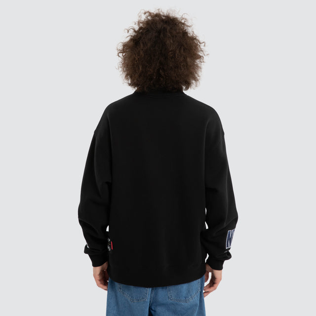 Model wears Ben Davis Geelong Cats AFL 1/4 Zip Thru Jet Black Pullover in Black - Image 5