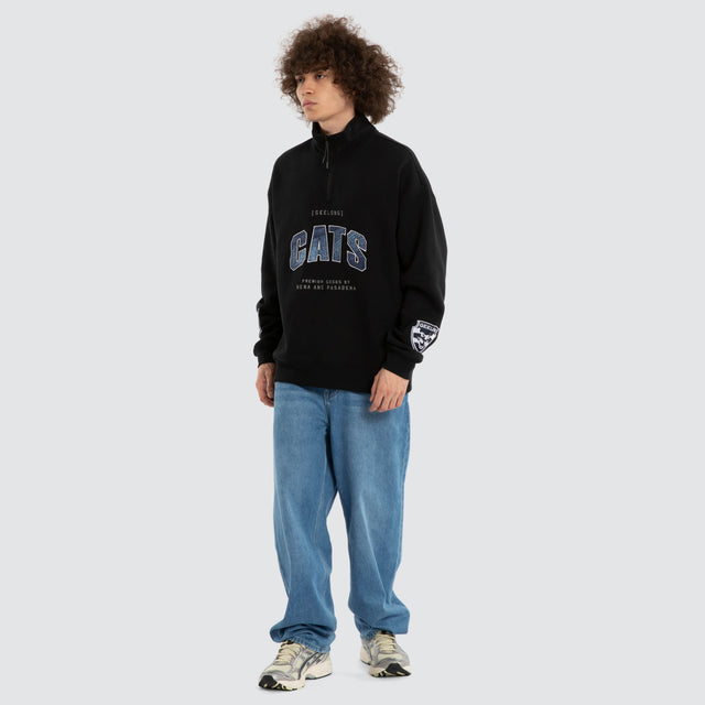 Model wears Ben Davis Geelong Cats AFL 1/4 Zip Thru Jet Black Pullover in Black - Image 7