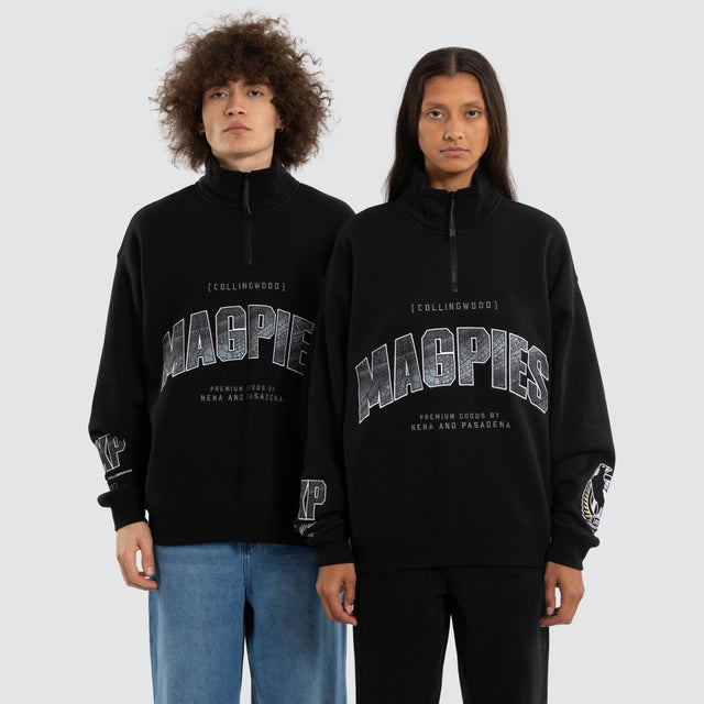 Model wears Ben Davis Collingwood Magpies AFL 1/4 Zip Thru Jet Black Pullover in Black - Image 1