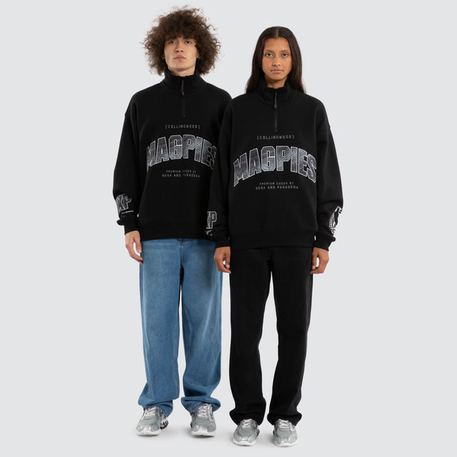Model wears Ben Davis Collingwood Magpies AFL 1/4 Zip Thru Jet Black Pullover in Black - Image 4