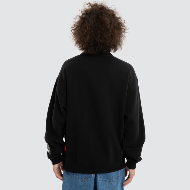 Model wears Ben Davis Collingwood Magpies AFL 1/4 Zip Thru Jet Black Pullover in Black - Image 5