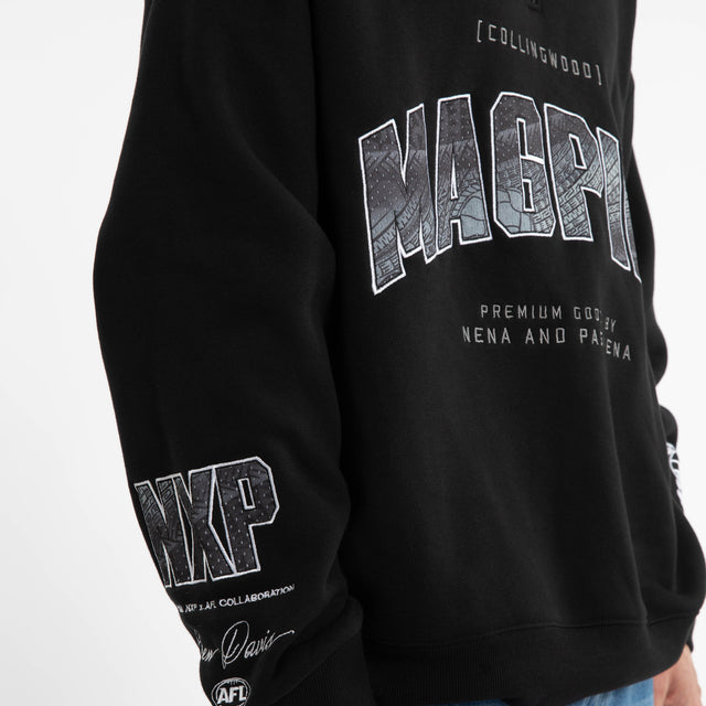Model wears Ben Davis Collingwood Magpies AFL 1/4 Zip Thru Jet Black Pullover in Black - Image 3