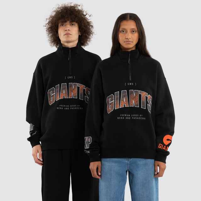 Model wears Ben Davis GWS Giants AFL 1/4 Zip Thru Jet Black Pullover in Black - Image 1