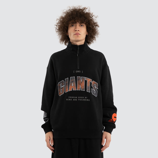 Model wears Ben Davis GWS Giants AFL 1/4 Zip Thru Jet Black Pullover in Black - Image 2