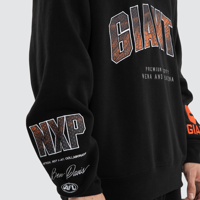 Model wears Ben Davis GWS Giants AFL 1/4 Zip Thru Jet Black Pullover in Black - Image 3