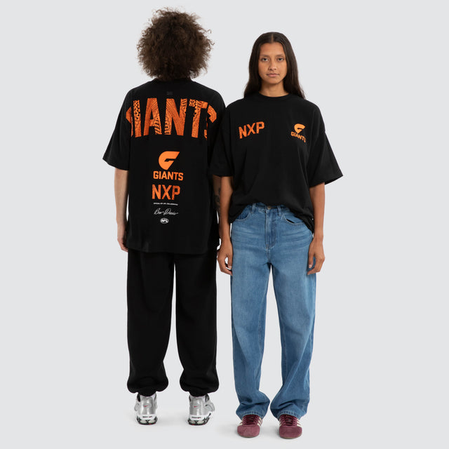 Model wears Ben Davis GWS Giants AFL Raptor Tee Jet Black T-Shirts in Black - Image 4
