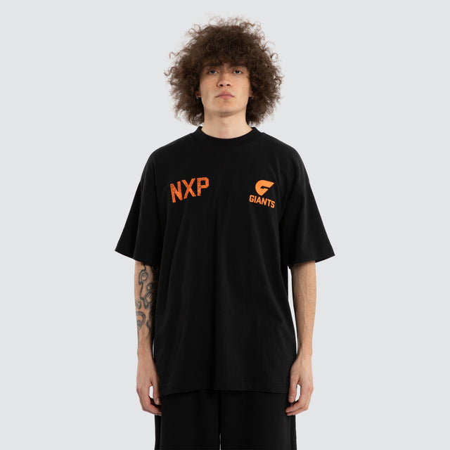 Model wears Ben Davis GWS Giants AFL Raptor Tee Jet Black T-Shirts in Black - Image 5