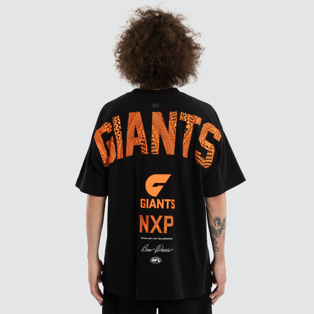 Model wears Ben Davis GWS Giants AFL Raptor Tee Jet Black T-Shirts in Black - Image 2