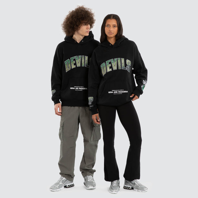 Model wears Ben Davis Tasmania Devils AFL Box Fit Hoodie Jet Black Hoodies in Black - Image 4