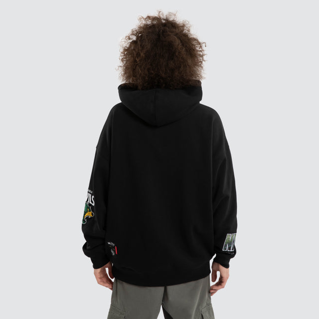 Model wears Ben Davis Tasmania Devils AFL Box Fit Hoodie Jet Black Hoodies in Black - Image 5