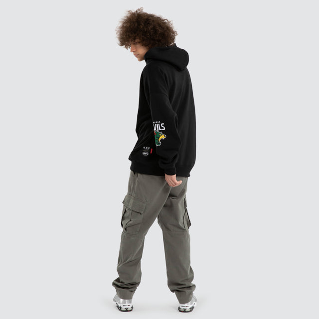 Model wears Ben Davis Tasmania Devils AFL Box Fit Hoodie Jet Black Hoodies in Black - Image 6