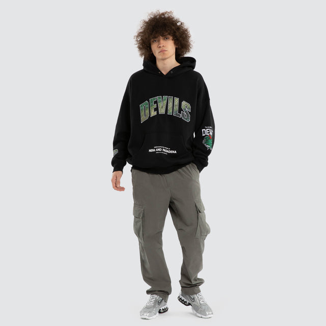 Model wears Ben Davis Tasmania Devils AFL Box Fit Hoodie Jet Black Hoodies in Black - Image 7
