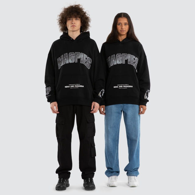 Model wears Ben Davis Collingwood Magpies AFL Box Fit Hoodie Jet Black Hoodies in Black - Image 4