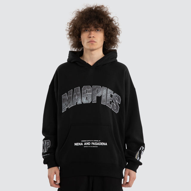 Model wears Ben Davis Collingwood Magpies AFL Box Fit Hoodie Jet Black Hoodies in Black - Image 2