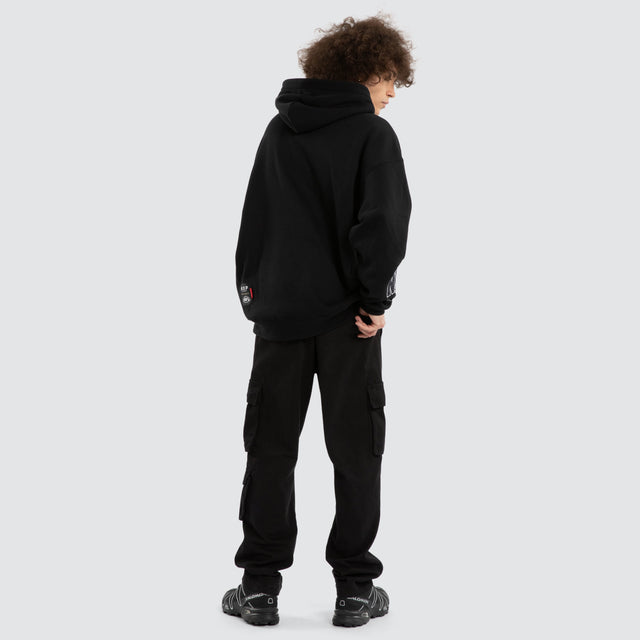 Model wears Ben Davis Collingwood Magpies AFL Box Fit Hoodie Jet Black Hoodies in Black - Image 6