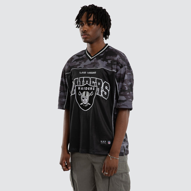 Model wears Las Vegas Raiders Field Tee Black Camo T-Shirts in Camo - Image 4
