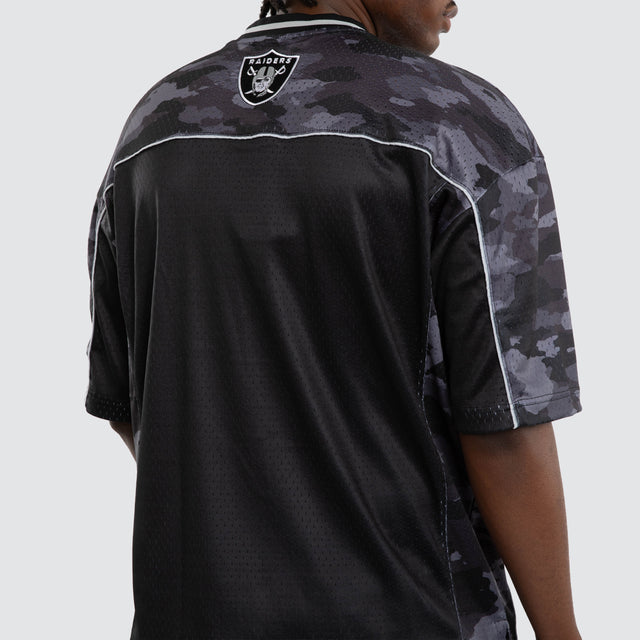Model wears Las Vegas Raiders Field Tee Black Camo T-Shirts in Camo - Image 6