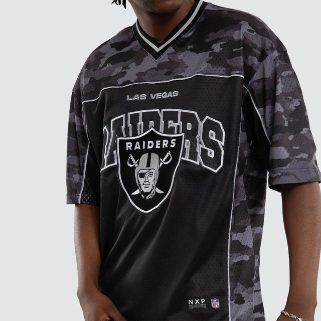 Model wears Las Vegas Raiders Field Tee Black Camo T-Shirts in Camo - Image 7