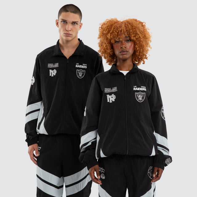 Model wears Las Vegas Raiders Racing Jacket Jet Black/Silver Jackets Black – image 1