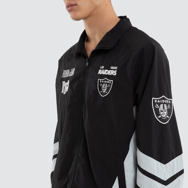 Model wears Las Vegas Raiders Racing Jacket Jet Black/Silver Jackets Black – image 5