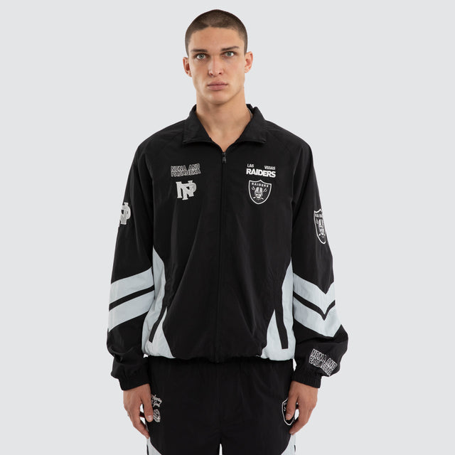 Model wears Las Vegas Raiders Racing Jacket Jet Black/Silver Jackets Black – image 4