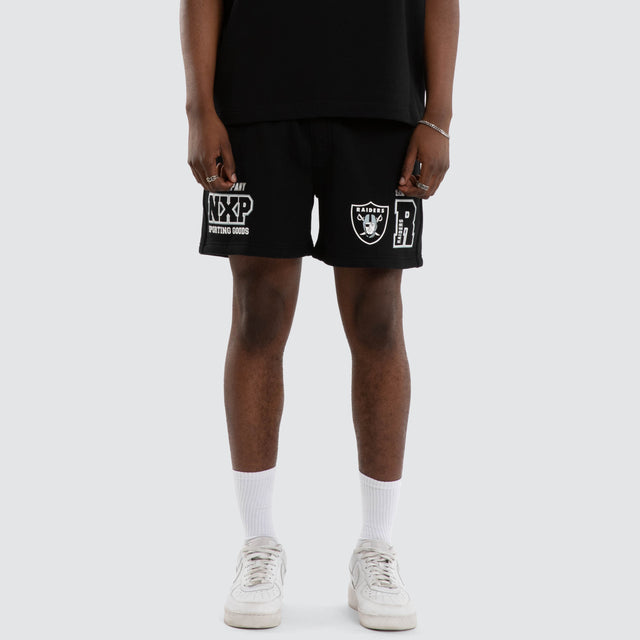 Model wears Las Vegas Raiders Sprinter Short Jet Black Shorts in Black - Image 1