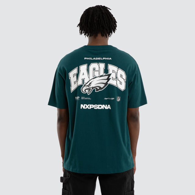 Model wears Philadelphia Eagles Driven Tee Midnight Green T-Shirts in Green - Image 1
