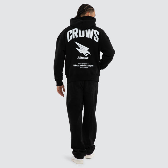 Model wears Adelaide Crows Champions Box Fit Hoodie Jet Black Hoodies in Black - Image 4