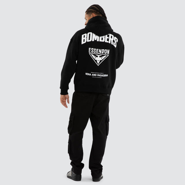 Model wears Essendon Bombers AFL Champions Box Hoodie Jet Black Hoodies in Black - Image 4