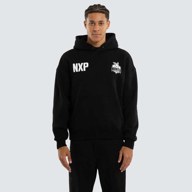 Model wears North Melbourne Kangaroos Champions Box Fit Hoodie Jet Black Hoodies in Black - Image 2