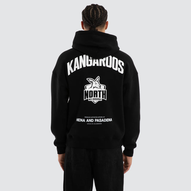 Model wears North Melbourne Kangaroos Champions Box Fit Hoodie Jet Black Hoodies in Black - Image 1