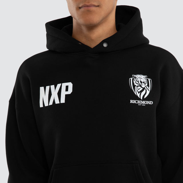 Model wears Richmond Tigers AFL Champions Box Hoodie Jet Black Hoodies in Black - Image 3