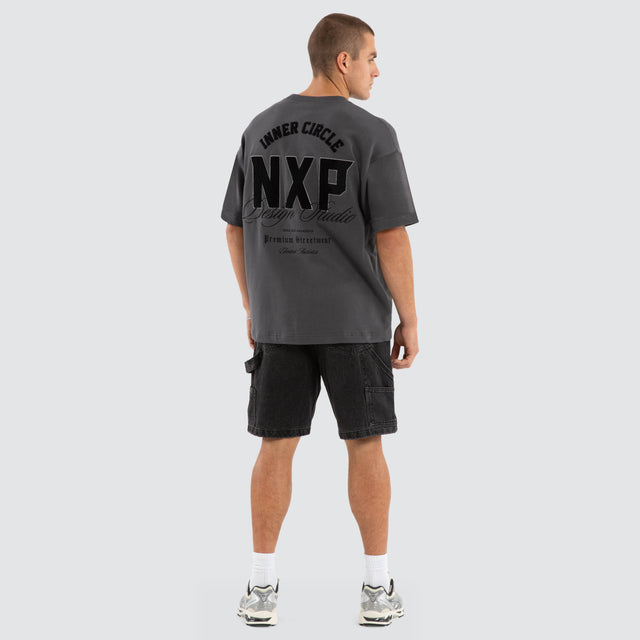 Model wears Dwell Loopback Raptor Tee Asphalt T-Shirts in Grey - Image 6