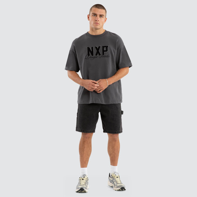 Model wears Dwell Loopback Raptor Tee Asphalt T-Shirts in Grey - Image 7