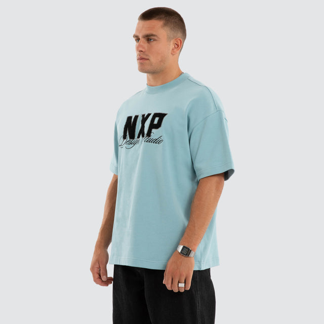 Model wears Dwell Cotton Loopback Tee in Blue T-Shirts in Blue - Image 5