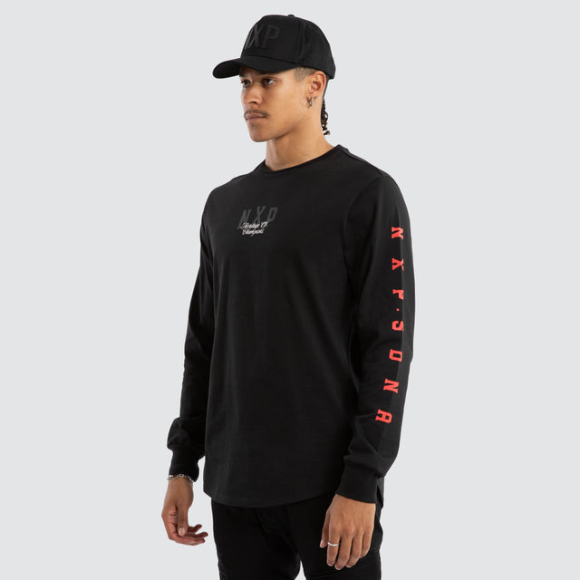 Model wears Final Dual Curved Longsleeve Tee Jet Black Longsleeve T-Shirts in Black - Image 3