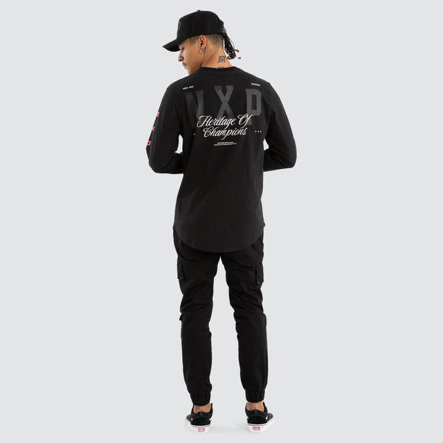 Model wears Final Dual Curved Longsleeve Tee Jet Black Longsleeve T-Shirts in Black - Image 4