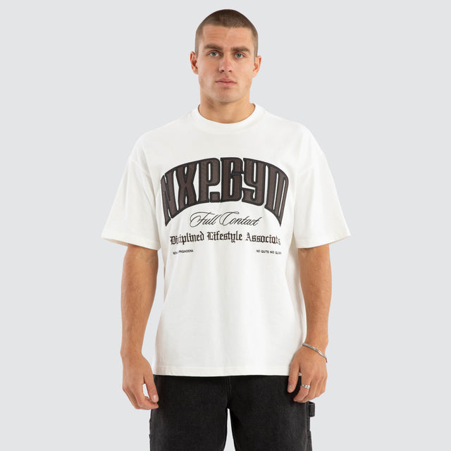 Model wears Citizens Raptor Tee Natural White T-Shirts in White - Image 1