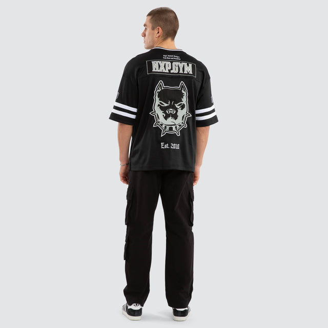 Model wears Brute Gridiron Jersey Jet Black Jerseys in Black - Image 6