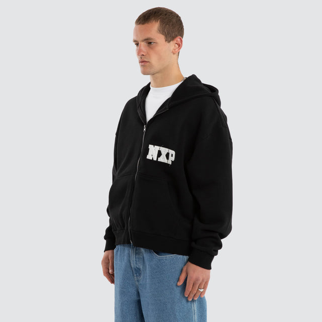 Model wears Realign Street Zip Hoodie Jet Black Hoodies in Black - Image 7