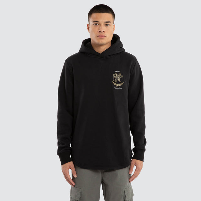 Model wears Ensemble Curved Hem Hoodie Jet Black Hoodies in Black - Image 1