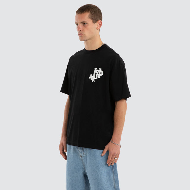 Model wears Conquer Raptor Tee Jet Black T-Shirts in Black - Image 7