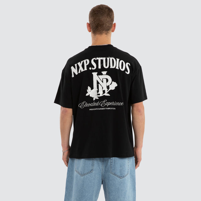 Model wears Conquer Raptor Tee Jet Black T-Shirts in Black - Image 2